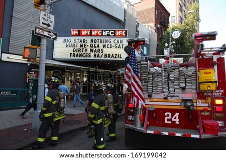NEW YORK CITY - JULY 6 2013: FDNY firefighters stow their gear away after responding to an emergency to the IFC Theater on Sixth Avenue in the West Village.