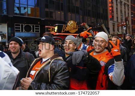 NEW YORK CITY - FEBRUARY 1 2014: Super Bowl Boulevard filled thirteen Midtown blocks with games & promotions in anticipation of Super Bowl 48. Denver Broncos Fans enter optimistically