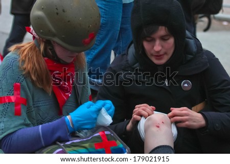 NEW YORK CITY, USA - DECEMBER 17 2011: Occupy Wall Street, protesting financial malfeasance, marked its 90 day anniversary with marches in Manhattan. First aid team treating marcher.