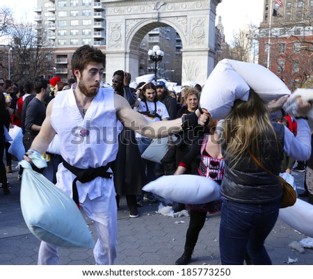 NEW YORK CITY - APRIL 5 2014: the first Saturday of April is International Pillow Fight Day, observed this time at Washington Square Park in Lower Manhattan. Black belt in pillow fighting demonstrates