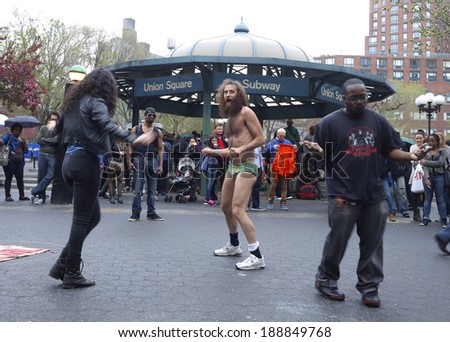 NEW YORK CITY - April 22 2014: Businesses mark Earth Day in Union Square Park with vendors, samples & other eco-friendly products & services. Matthew Silver finds willing dancers in Union Square