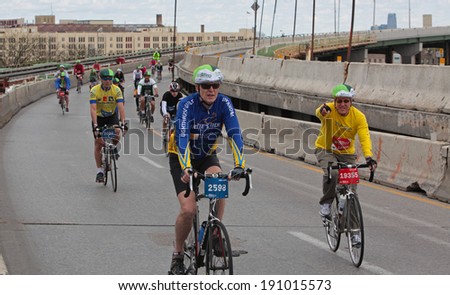 NEW YORK CITY - MAY 4 2014: Bike New York\'s annual Five Borough Ride was sponsored by REI & TD Bank. 32000 riders filled a car-free Brooklyn Queens Expressway on their way to the Staten Island finale