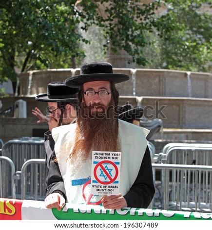 NEW YORK CITY - JUNE 12014: The 50th annual Israel Day Parade drew thousands to the Upper East Side of Manhattan to honor the state\'s 66th anniversary.  Neturei Karta protesting Zionism