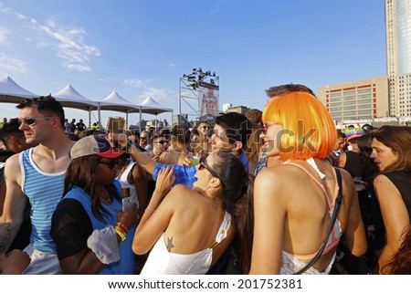NEW YORK CITY - JUNE 29 2014: Heritage of Pride sponsored a post Pride Parade Dance on Pier 26 in Tribeca attended by several thousand celebrants.