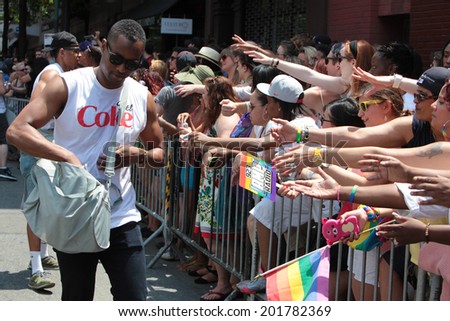 NEW YORK CITY - JUNE 29 2014: Heritage of Pride sponsored the nation\'s largest Gay Pride parade in Manhattan that stretched along Fifth Avenue to Christopher Street. Passing out samples of Diet Coke