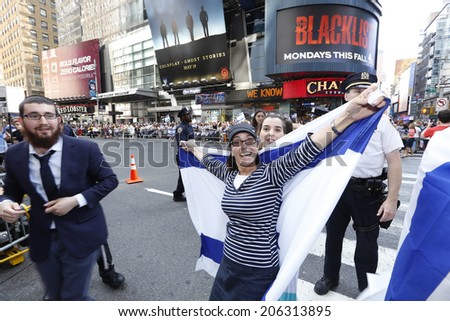 NEW YORK CITY - JULY 20 2014: several thousand supporters of Israeli actions in Gaza staged a rally in Times Square. Orthodox Jewish woman posing with Israeli flag