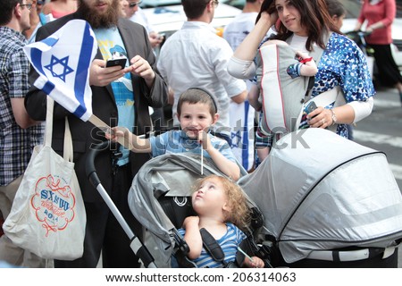 NEW YORK CITY - JULY 20 2014: several thousand supporters of Israeli actions in Gaza staged a rally in Times Square. Toddlers attend rally with Orthodox parents