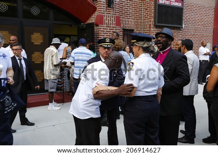 NEW YORK CITY - JULY 23 2014: Funeral services for Eric Garner, the Staten Island resident who died while being taken into custody by NYPD.  Community Affairs Bureau chief Joanne Jaffe with mourners