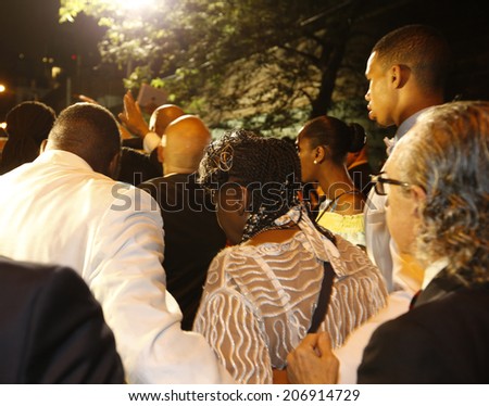 NEW YORK CITY - JULY 23 2014: Funeral services for Eric Garner, the Staten Island resident who died while being taken into custody by NYPD.  Gwen Carr, mother of Eric Garner, escorted out of church