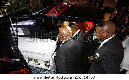 NEW YORK CITY - JULY 23 2014: Funeral services for Eric Garner, the Staten Island resident who died while being taken into custody by NYPD.  Eric Garner\'s coffin placed inside hearse