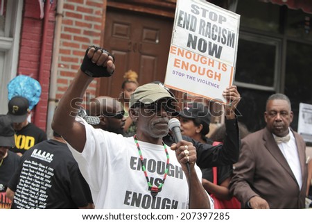 NEW YORK CITY - JULY 26 2014: Black Lawyers for Justice & the New Black Panther Party staged a rally in Staten Island on behalf of Eric Garner who died after a scuffle with NYPD officers