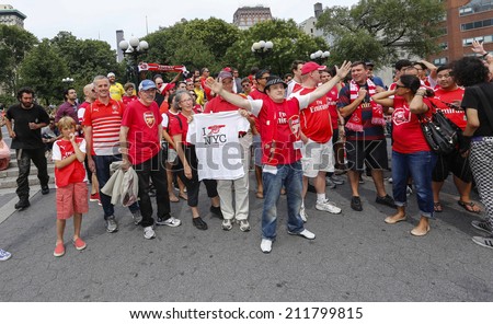 NEW YORK CITY - AUGUST 16 2014: Arsenal NYC Football Club supporters held a rally & photo shoot to celebrate their team's winning season in Union Square Park