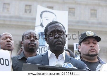 NEW YORK CITY - AUGUST 20 2014: the family of Ramarley Graham, a Bronx teen shot killed in his home by NYPD in 2012, gathered at Foley Square to deliver a petition to the US Attorney demanding action