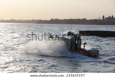 NEW YORK CITY - SEPTEMBER 10 2014: US Coast Guard Response Boat Small Class patrolling New York Harbor just past Ellis Island. The RB-S is noted for  maneuverability with a top speed over 40 knots.