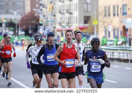NEW YORK CITY - NOVEMBER 2 2014: the 43rd annual NYC Marathon saw more than 50,000 entrants race through all five boroughs.Elite men\'s division runners in pack on mile four in Brooklyn