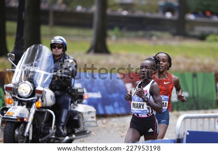 NEW YORK CITY - NOVEMBER 2 2014: the 43rd annual New York City Marathon saw more than 50,000 entrants run through all five boroughs. Women\'s division winner Mary Keitany enters Central Park