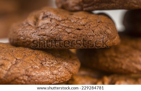 Homemade, rustic looking chocolate, chocolate chip cookies stacked on serving platters