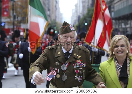NEW YORK CITY - NOVEMBER 11 2014: the 95th annual Veteran's Day parade along Fifth Avenue is the largest Nov 11 celebration in the United States. US Representative Carolyn Maloney with WW ii vet