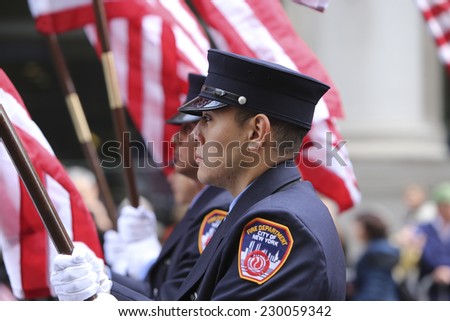 NEW YORK CITY - NOVEMBER 11 2014: the 95th annual Veteran's Day parade along Fifth Avenue is the largest Nov 11 celebration in the United States. FDNY color guard