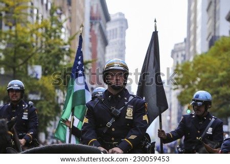 NEW YORK CITY - NOVEMBER 11 2014: the 95th annual Veteran's Day parade along Fifth Avenue is the largest Nov 11 celebration in the United States. NYPD mounted police at fore of parade