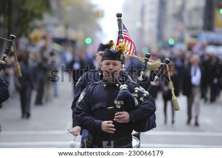 NEW YORK CITY - NOVEMBER 11 2014: the 95th annual Veteran\'s Day parade along Fifth Avenue is the largest Nov 11 celebration in the United States. Bagpipers along Fifth Avenue
