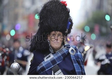 NEW YORK CITY - NOVEMBER 11 2014: the 95th annual Veteran\'s Day parade along Fifth Avenue is the largest Nov 11 celebration in the United States. FDNY  Emerald Society marching band drum major