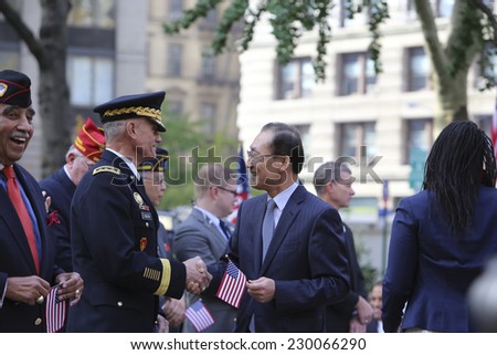 NEW YORK CITY - NOVEMBER 11 2014: the 95th annual Veteran's Day parade along Fifth Avenue is the largest Nov 11 celebration in the United States. Korean consul general Se-Joon Son greet Gen John Kelly