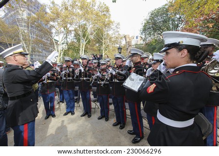 NEW YORK CITY - NOVEMBER 11 2014: the 95th annual Veteran's Day parade along Fifth Avenue is the largest Nov 11 celebration in the United States. US Marine Corps band plays Star Spangled Banner