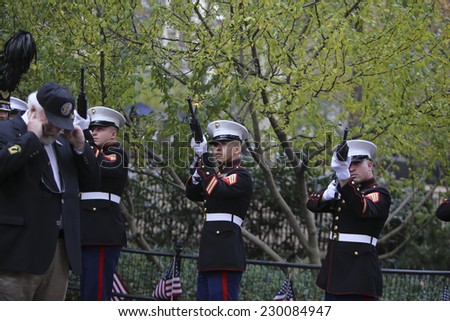 NEW YORK CITY - NOVEMBER 11 2014: the 95th annual Veteran's Day parade along Fifth Avenue is the largest Nov 11 celebration in the United States. Firing salute during wreath laying