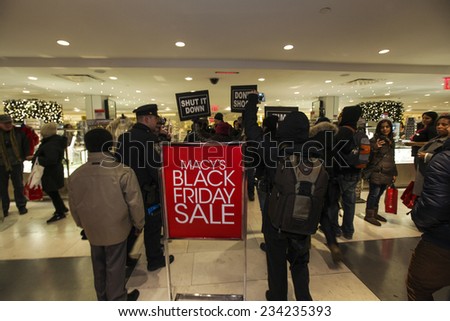 NEW YORK CITY - NOVEMBER 28 2014: several hundred activists gathered in Herald Square to urge passersby to boycott Black Friday sales at Macy\'s & other department stores in outrage over Mike Brown