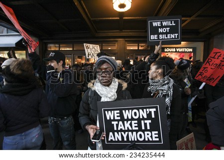 NEW YORK CITY - NOVEMBER 28 2014: several hundred activists gathered in Herald Square to urge passersby to boycott Black Friday sales at Macy's & other department stores in outrage over Mike Brown