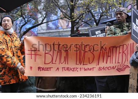 NEW YORK CITY - NOVEMBER 28 2014: several hundred activists gathered in Herald Square before marching to Times Square to protest & urge shoppers to boycott Black Friday sales in memory of Mike Brown