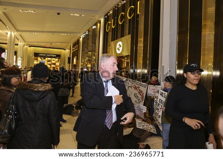 NEW YORK CITY - DECEMBER 10 2014: Stop Mass Incarcerations Network hosted a rally in Herald Square on day 7 in the death of Eric Garner, followed by a brief occupation of Macy\'s Department store
