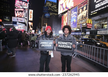 NEW YORK CITY - DECEMBER 12 2014: Carry the Names staged a rally in Times Square where 60 activists held signs naming people killed or injured by law enforcement