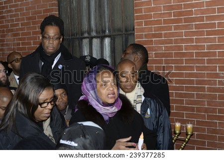 NEW YORK CITY - DECEMBER 21 2014: community leaders from all over NYC attended a candlelight memorial for NYPD officers Wenjin Liu & Rafael Ramos in Bedford-Stuyvescent, Brooklyn