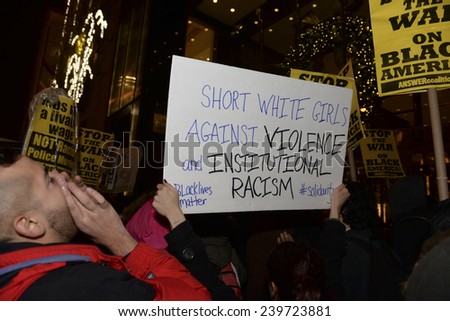 NEW YORK CITY - DECEMBER 23 2014: several hundred protesters filled Fifth Avenue to march against police brutality & holiday consumerism in defiance of Mayor De Blasio\'s call for a halt to protests