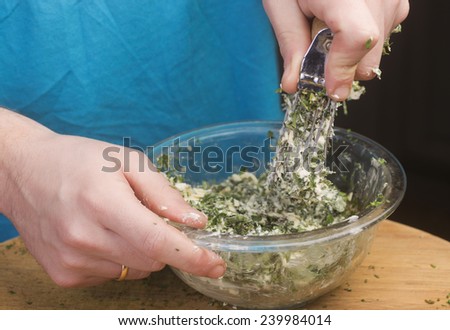 Making herb butter/working chopped herbs into butter with pastry cutter