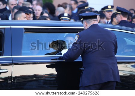 NEW YORK CITY - DECEMBER 27 2014: along with political leaders, uniformed police officers from all over north America attended funeral services for NYPD officer Rafael Ramos. Justin Ramos in limosine