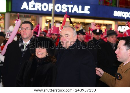 NEW YORK CITY - DECEMBER 31 2014: more than one million celebrants marked the new year in Times Square. NYPD Commissioner William Bratton & spouse Rikki Klieman