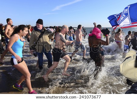 NEW YORK CITY - JANUARY 1 2014: several hundred people took part in the 9th annual Polar Bear Plunge in Coney Island, Brooklyn, to raise funds for Camp Sunshine