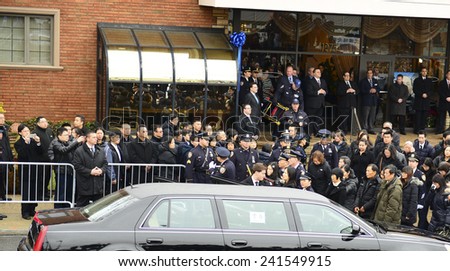NEW YORK CITY - JANUARY 4 2015: several thousand police officers from all over North America attended funeral services for slain NYPD officer Wenjian Liu in Brooklyn. Family of Wenjian Liu arrives