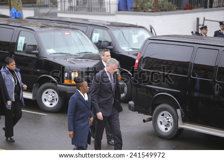 NEW YORK CITY - JANUARY 4 2015: several thousand police officers from all over North America attended funeral services for slain NYPD officer Wenjian Liu in Brooklyn.Mayor De Blasio & Chirlaine McCray
