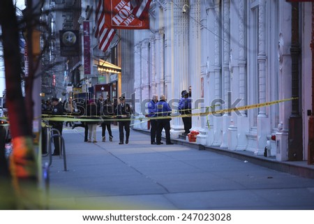 NEW YORK CITY - JANUARY 25 2015: a shooting at the Home Depot store in Chelsea left two employees dead in what is being called a murder-suicide. 23rd Street sidewalk sealed off in front of Home Depot