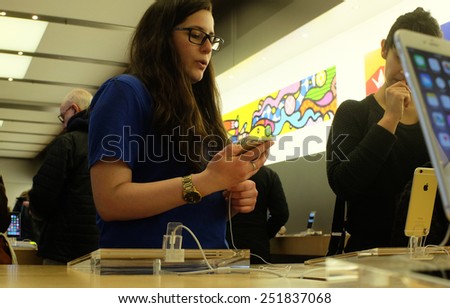 NEW YORK CITY - FEBRUARY10 2015: Apple closed the NYSE with a market capitalization of $705 billion dollars, the first company ever to breach $700 billion. Demonstrating new products