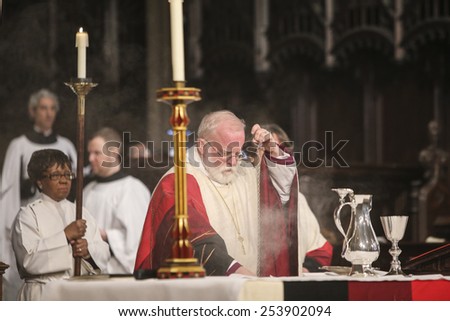 NEW YORK CITY - FEBRUARY 18 2015: Ash Wednesday was celebrated at Trinity Church with a mass conducted by Bishop Andrew Dietsche followed by 