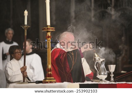 NEW YORK CITY - FEBRUARY 18 2015: Ash Wednesday was celebrated at Trinity Church with a mass conducted by Bishop Andrew Dietsche followed by 