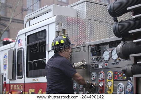 NEW YORK CITY - MARCH 27 2015: one day after a fire & explosion in Manhattan\'s East Village, two people remain missing while emergency personnel clear the wreckage of three destroyed brownstones
