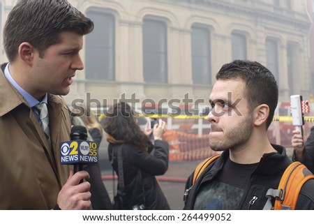 NEW YORK CITY - MARCH 26 2015: an explosion & fire on East 7th St in Manhattan\'s East Village destroyed three brownstones, left 14 people injured & two people missing. Local resident interviewed.
