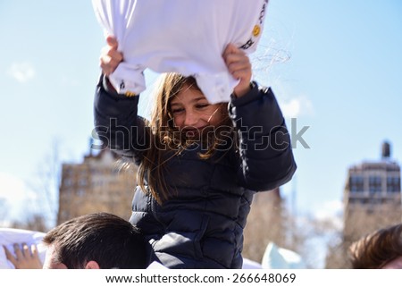 NEW YORK CITY - APRIL 4 2015: the 7th annual International Pillow Fight Day, held on the first Saturday of April, took place in Washington Square Park