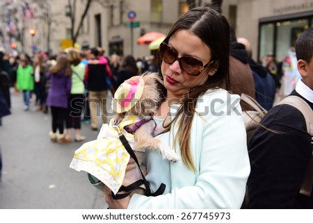 NEW YORK CITY - APRIL 5 2015: thousands of New Yorkers filled 5th Avenue marking Easter Sunday with the tradition Easter Bonnet Parade, a tradition dating from the 1870s. Lillie, a long-hair Chihuahua